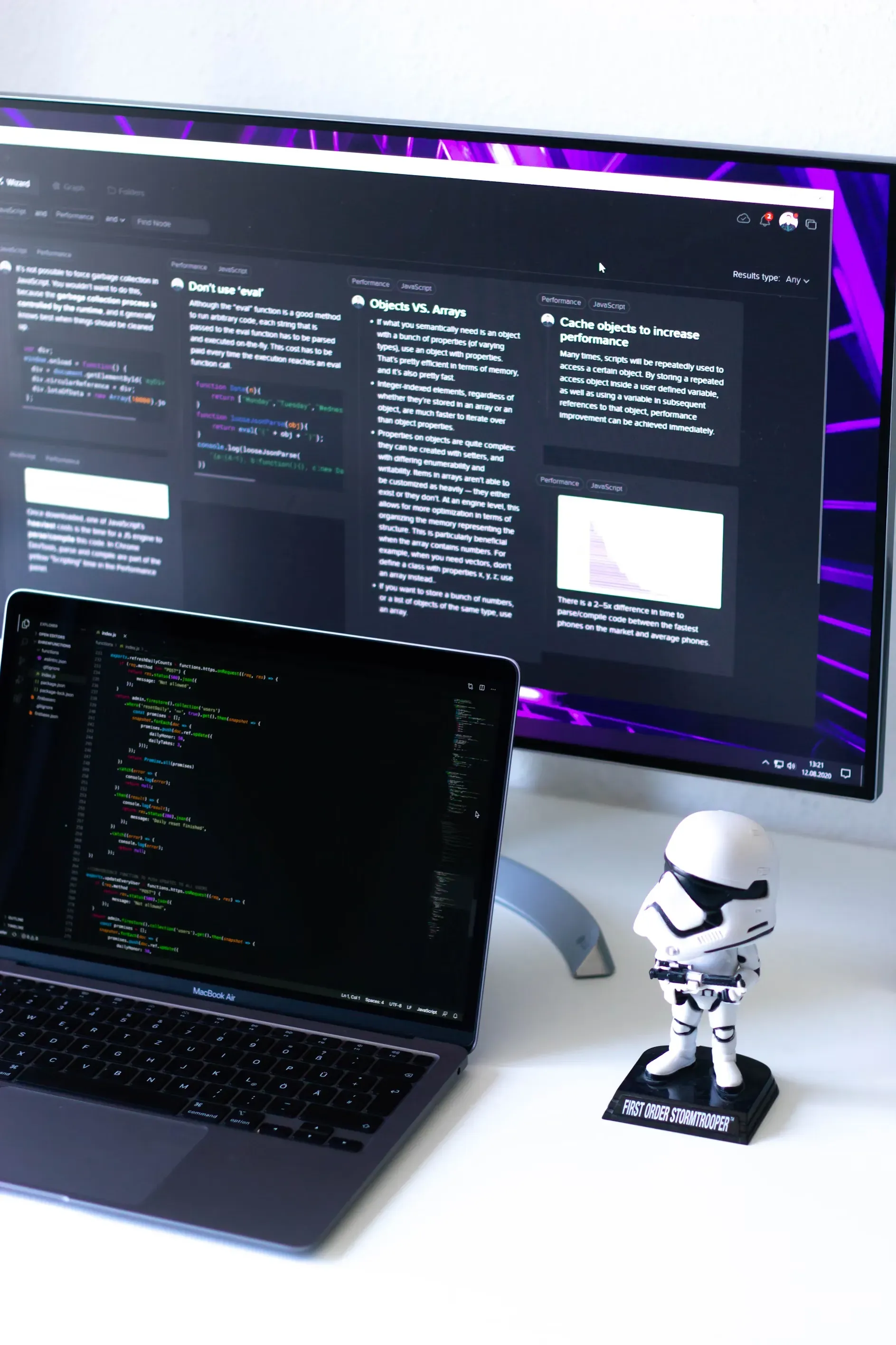 Developer desk with code on screen